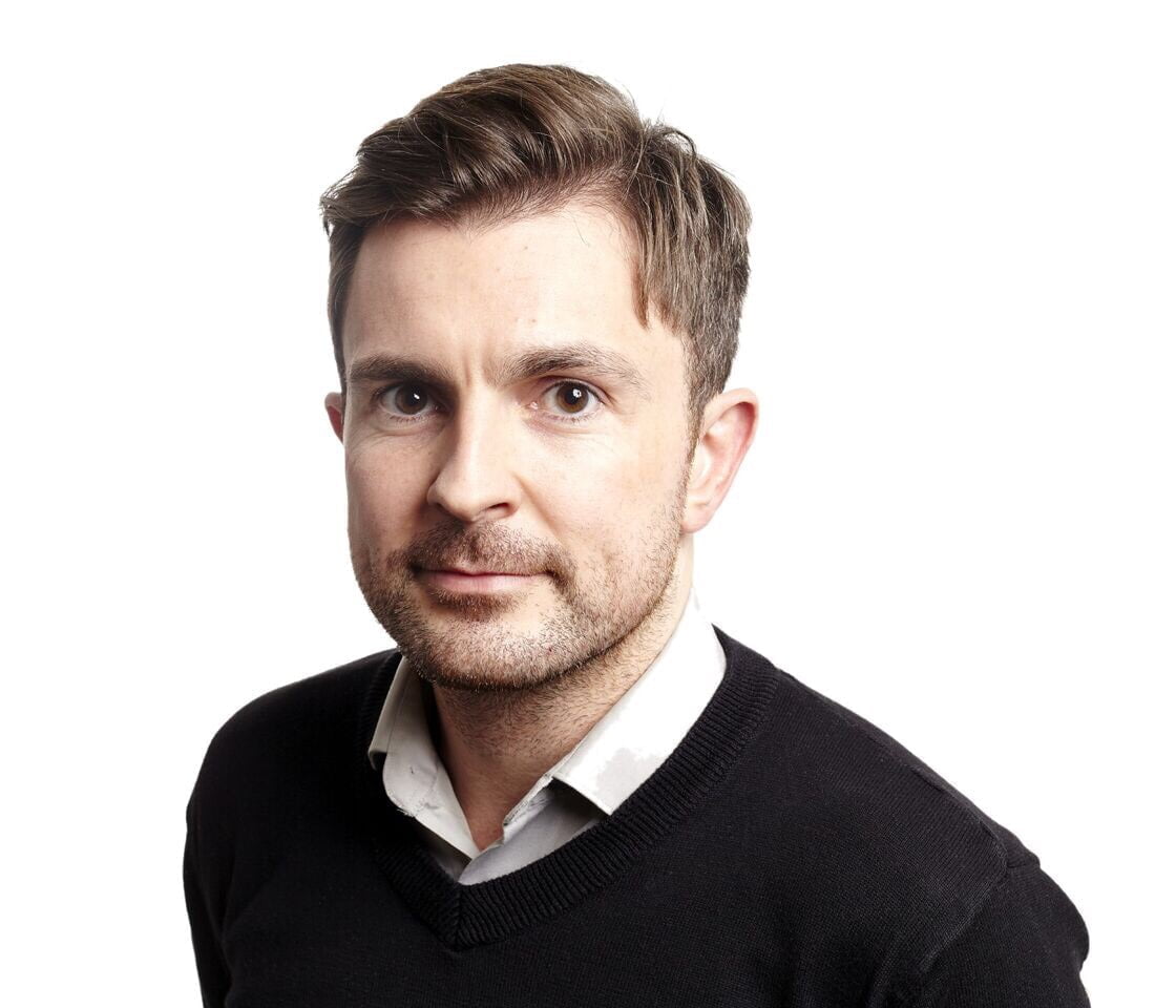 Headshot of Gerard Starkey on a white background.