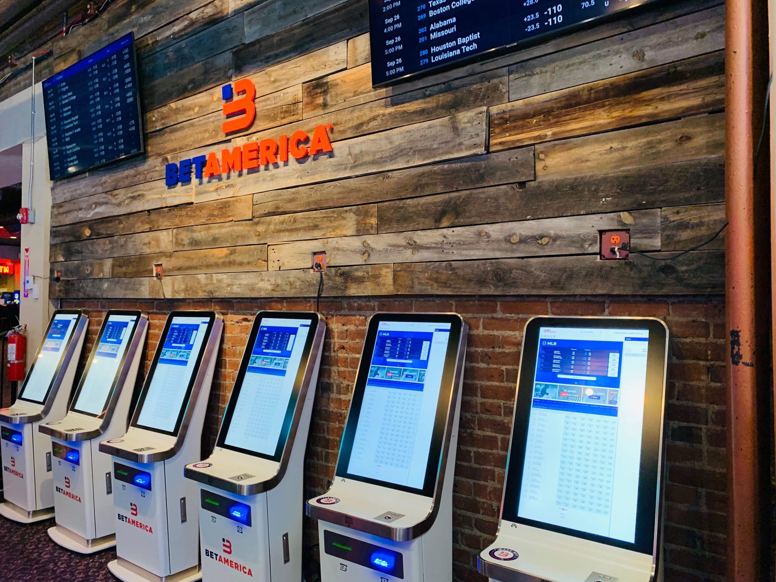 A picture of a Bet America shop with multiple betting machines.